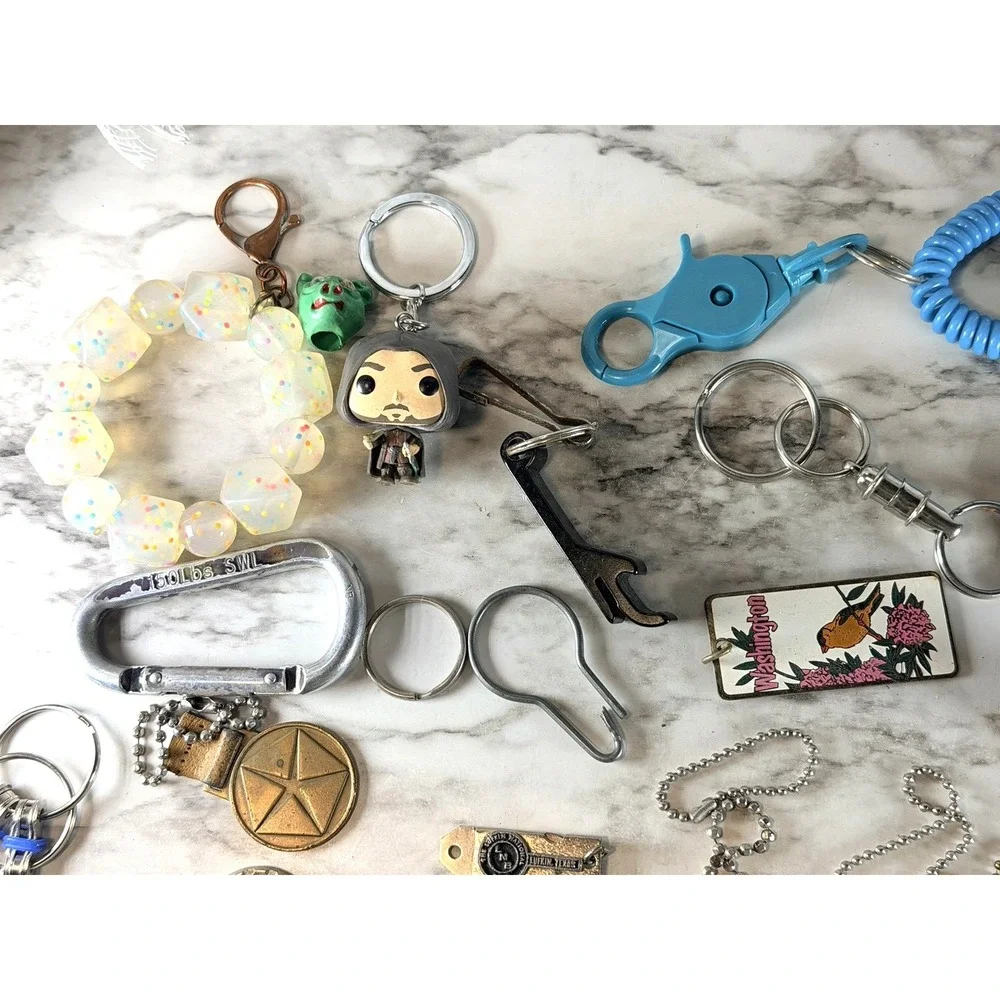 25 KEY RINGS ~BOTTLE OPENER, 150 LB CLIP, FIRE STARTER, BRACELET, ETC (3002)
